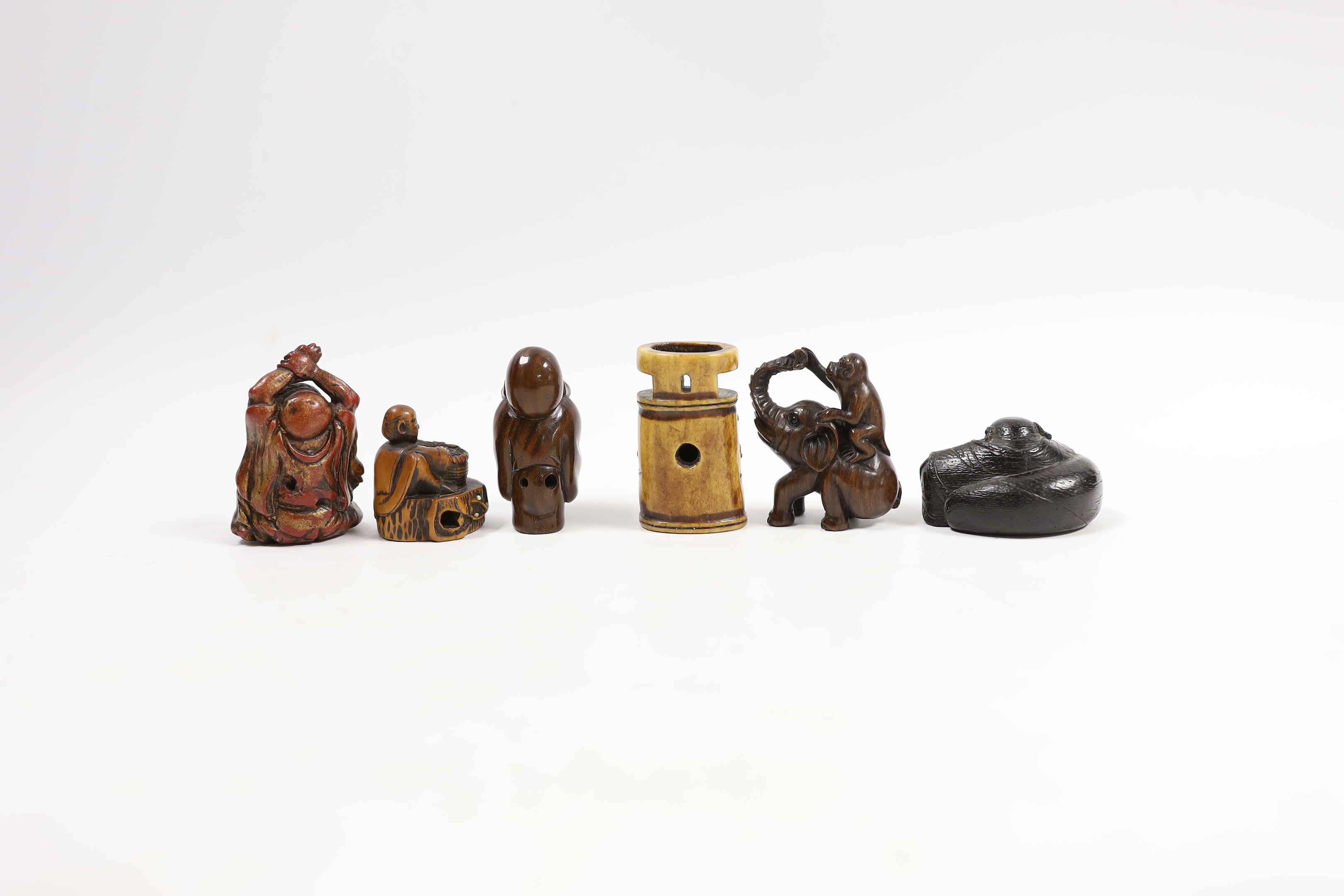 A group of six Japanese netsuke in wood, staghorn and lacquer, 19th century and later